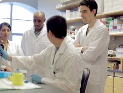 MS PAN Lab technicians watching man using micro-pipette at Cancer research Healthcare medicine Industry  DNA sequencing Laboratory / Vancouver, BC, Canada    Stock Footage