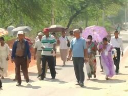 MS PAN Shot of Group of people walking on road / Delhi, India Stock Footage