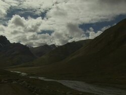 Pan Left Wide Mountains with Clouds Taklakot Tibet China Stock Footage
