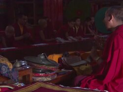 MS Buddhist monk ringing bell and chants in front of chanting young monks / Kathmandu, Central Region,Nepal Stock Footage