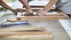 Carpenter used air gun on woodwork Stock Footage
