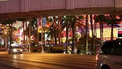 Cars on Las Vegas Boulevard at dusk, Las Vegas, Nevada, USA, probably the most unsustainable city in the world, it uses vast quantities of water in the middle of a desert and vast amounts of energy to power this most profligate of cities. Stock Footage