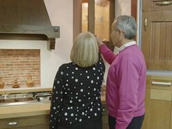 MS TS mature couple walking checking build quality of furniture in display of traditional kitchen furniture Stock Footage
