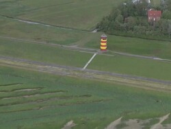 AERIAL WS ZI View of lighthouse / Pilsum+Greetsiel, Lower Saxony, Germany Stock Footage