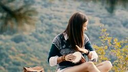 Hippie girl playing drum Stock Footage