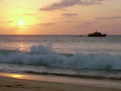 WS View of One boat standing on beach near Santa Maria during sunset / Santa Maria, Sal, Cape Verde Stock Footage