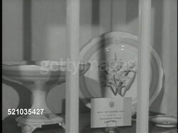 MOT 1948: WASHINGTON, D.C.: THE WHITE HOUSE: VS China Room, Male staff member wiping glass front cabinet, TU 'China Used By The Presidents' sign, VS Pattern collection, President Grant, President Woodrow Wilson Lenox w/ raised gold seal, FDR. Instructional Video