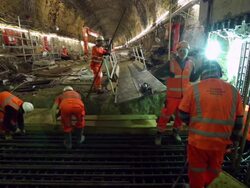 Mid shot of workers, putting together metal rods Stock Footage