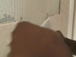 HD: Detail Shot of African American Woman Removing Old Tiles Stock Footage