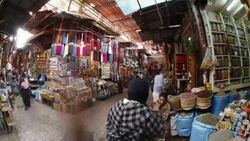 Shoppers maneuver through the Souq in Marrakech, Morocco. Stock Footage