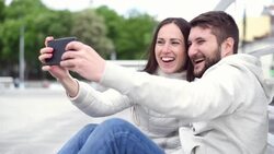 young adult couple taking selfie on the smartphone Stock Footage