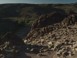 Static shot of rocky Moroccan terrain, changing to moving shot as more scenery comes into view. Stock Footage