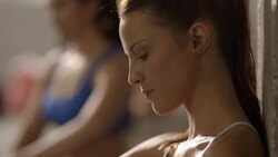 Caucasian women drinking water after working out Stock Footage