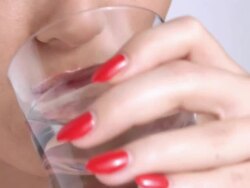 Woman taking a pill Stock Footage