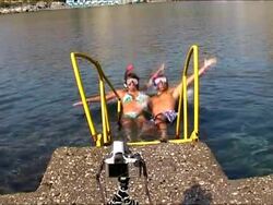 Couple making a funny holiday picture at the sea Stock Footage