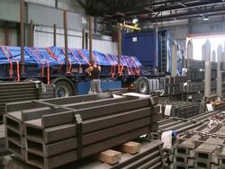 WS TD View of steel channels with man working in store at Hoesch-Schwerte / Schwerte, Rhineland-Palatinate, Germany Stock Footage