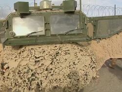 MS PAN Soldiers standing by armored vehicle / Musa Qala, Helmand Province, Afghanistan. Stock Footage