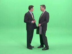 WS, Two businessmen passing bundle of money and briefcase to each other in studio Stock Footage