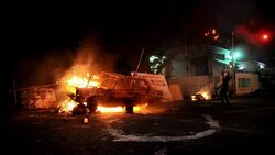 CLEAN : Protesters in Venezuela block a road with News Clip