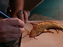 leatherworker paint  fish pattern on leather Stock Footage