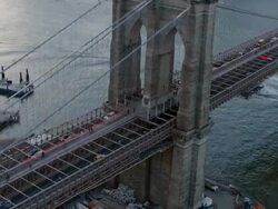 Aerial of downtown Manhattan and Brooklyn bridge at sunset Stock Footage