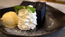 Charcoal toast with ice-cream and whip cream Stock Footage