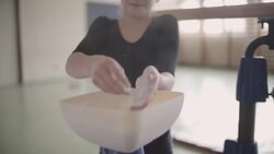 4K: Girl applying sport chalk on gymnastics bar. Stock Footage