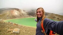Young woman takes selfie portrait at the Emerald lakes, Tongariro Stock Footage