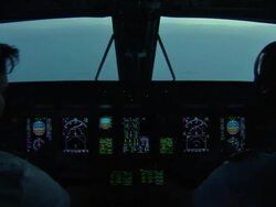 Pilots in cockpit of executive jet descending News Clip