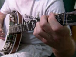 Medium Close Up static - A musician plays a banjo /  California, United States Stock Footage