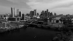 Aerial View Austin Texas Skyline Colorado River Fun Spring water activities looking at Skyline Cityscape black and white slow moving nice motion Stock Footage