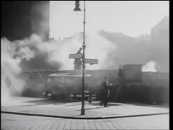 B/W 1961 PAN from people by Berlin Wall with smoke to people watching on sidewalk / Germany / newsreel Stock Footage