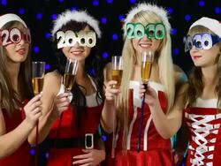 Santa Girl's holding champagne and say Happy New Year Stock Footage
