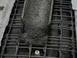 Pouring concrete into the iron mold Stock Footage