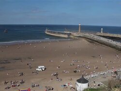 BEACH TWIN PIERS AND ENTRANCE TO HARBOUR Stock Footage