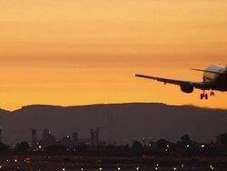 airplane landing in sunset Stock Footage
