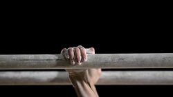 SLO MO Hands of gymnast performing routine on parallel bars Stock Footage