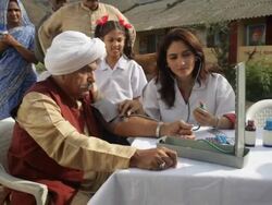 Two doctors checking rural people  Stock Footage