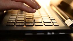 HD:Young woman typing on laptop keyboard Stock Footage