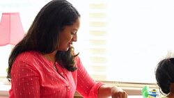 MS Mother working on puzzle with young daughter in bedroom Stock Footage