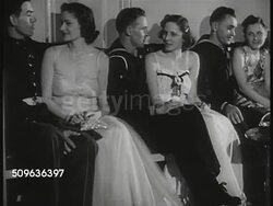 1939: NAVY PARTY: Officer & enlisted men sitting w/ young adult women talking. NAVAL WHITE WEDDING: Iconic Military Naval Officers in dress whites holding swords up as bride & Naval Officer groom walking under sword arch. Instructional Video