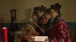 Taoist monks play instruments as incense wafts through the Bai Yun Guan temple in Beijing. Stock Footage