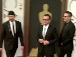 U2 members The Edge, Adam Clayton, Bono, Larry Mullen Jr. - 86th Annual Academy Awards - Arrivals Stock Footage