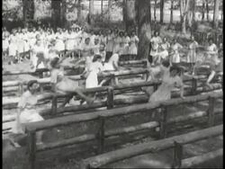 Members of the Women's Army Corps run an obstacle course. News Clip