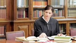 Judge doing research at desk Stock Footage