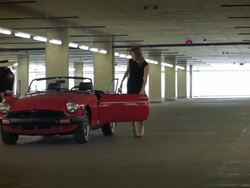 Red Convertible Transforms into a Suitcase Stock Footage