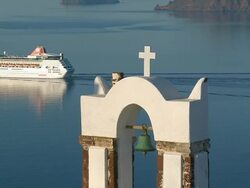 CU Shot of church bell and cuise ship moving in Ocean at Oia / Santorini, Cyclades, Greece Stock Footage