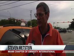 Ten years after the arrival of the first detainee at Guantanamo Bay, protesters are calling for the military detention center in Cuba to close News Clip