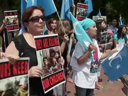 2009 MS PAN Row of protestors shouting slogans and leader wearing Barack Obama, 'hope', t-shirt during an anti-China protest outside the White House in support of the Uygurs/ Washington D.C., USA/ AUDIO Stock Footage