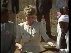 July 12, 1993 FILM MONTAGE MS ZI Princess Diana serving food to hungry people at Red Cross food station/ MS Diana sitting with children as they eat/ Zimbabwe/ AUDIO Stock Footage